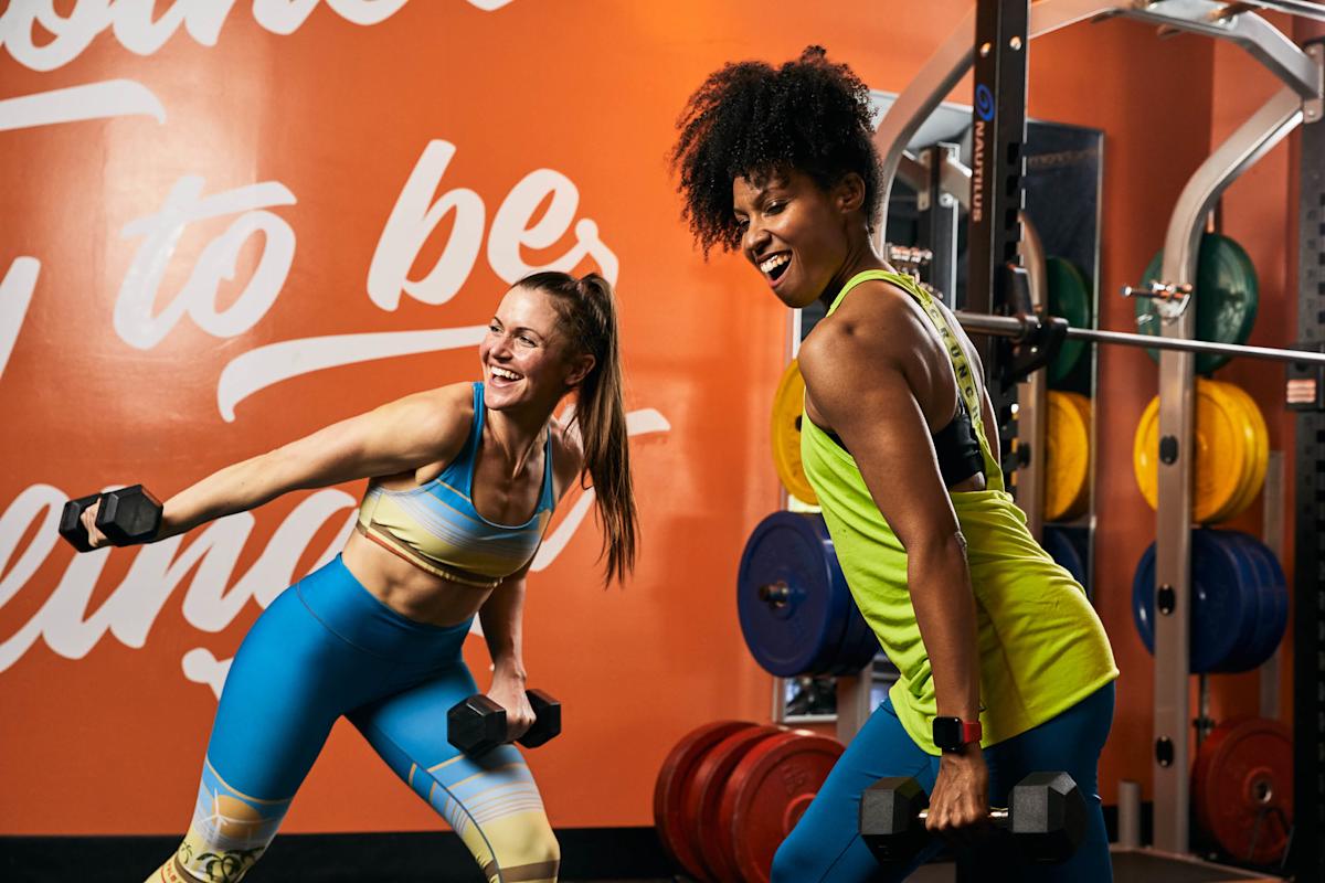 People lifting weights inside Crunch Fitness Gym in NYC