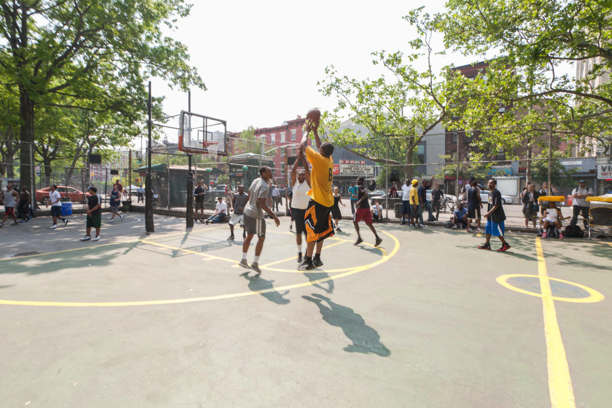 People playing basketball at West 4th Street Courts in Manhattan, NYC