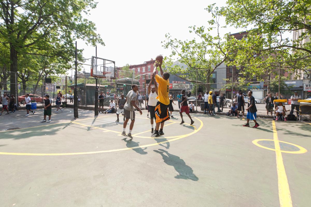 People playing basketball at West 4th Street Courts in Manhattan, NYC