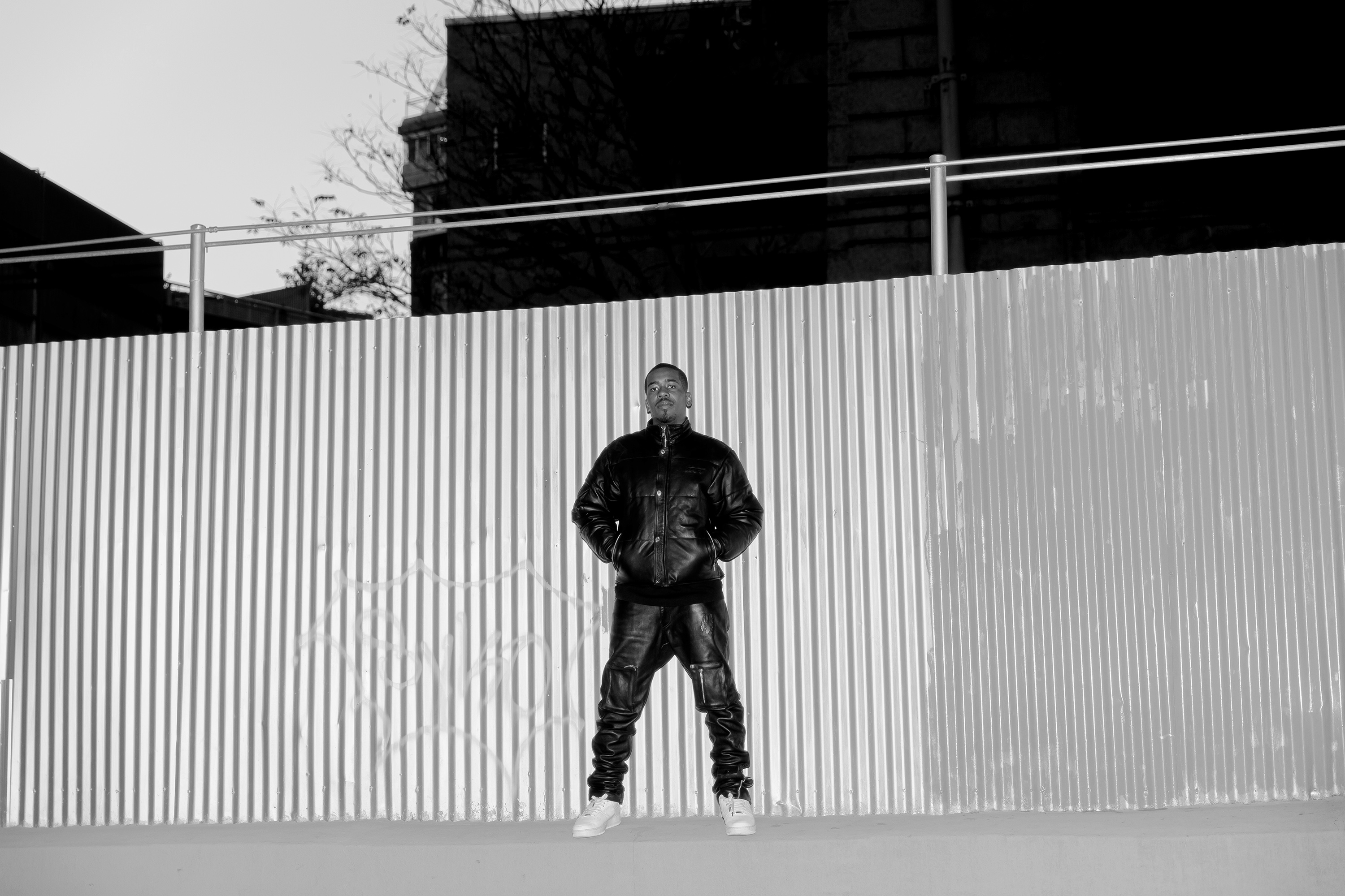 Nigeria Ealey standing in front of a fence