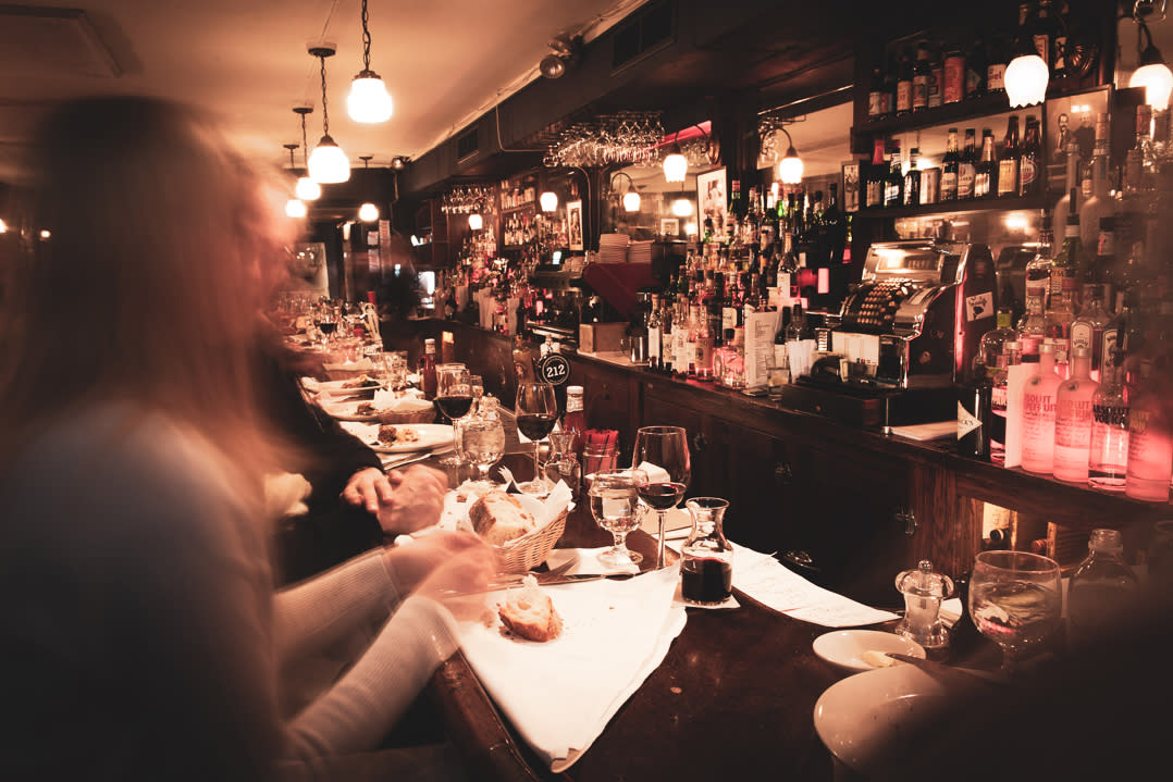 People eating at the bar in Joe Allen, Midtown West, NYC