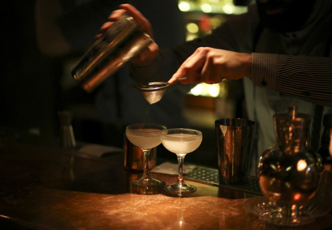 Bartender serving drinks at The Clocktower in Manhattan,NYC