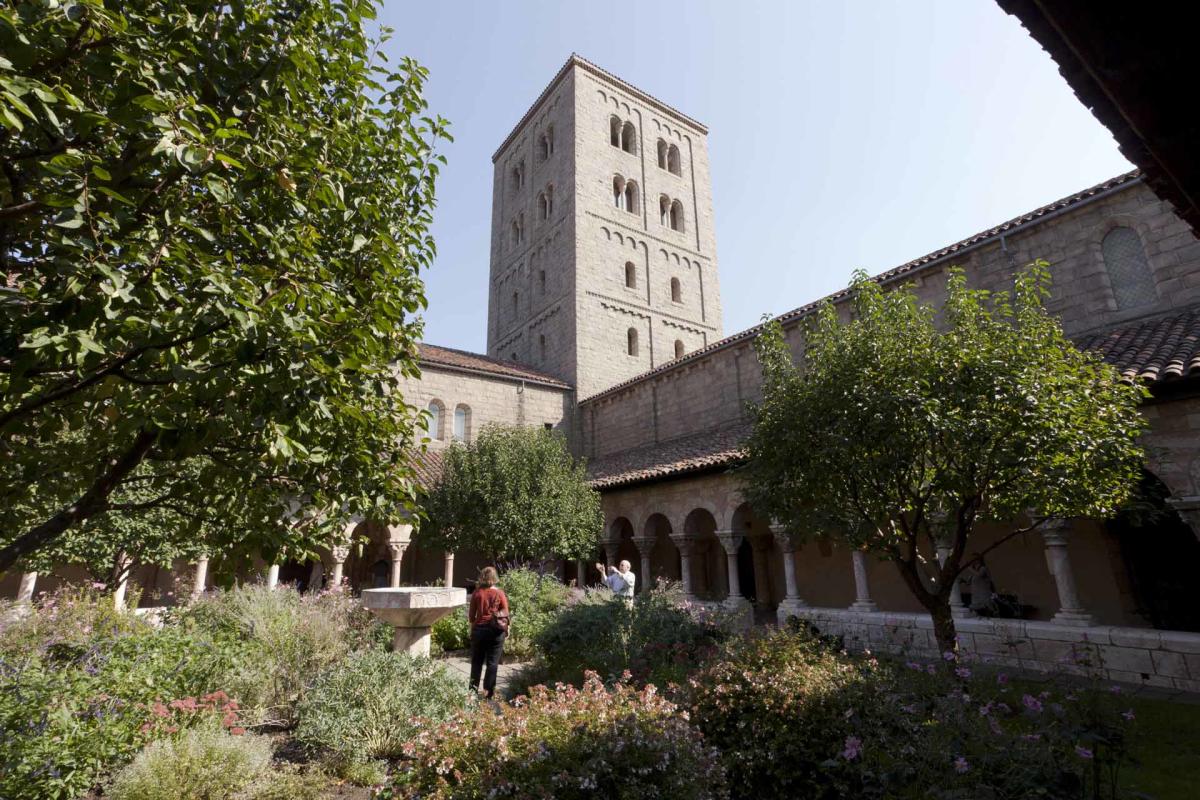 Arches and interior garden of The Met Cloisters in Manhattan, NYC