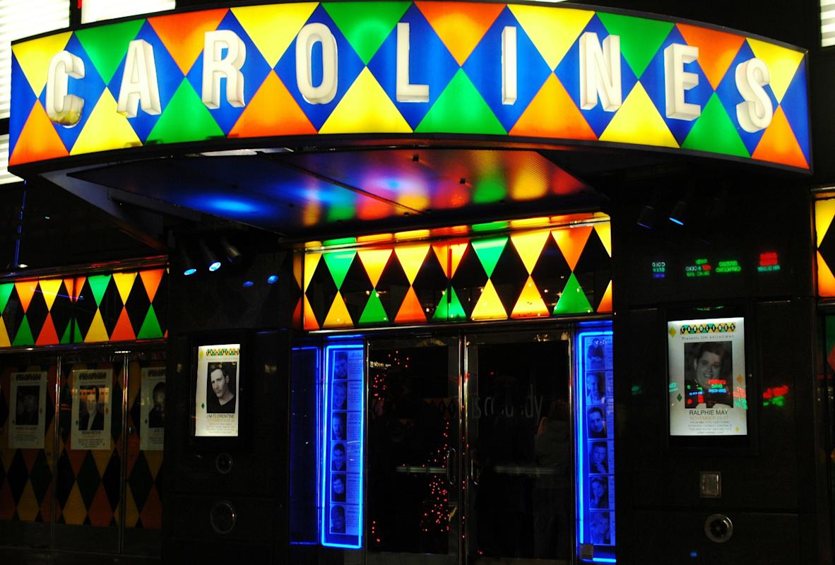 exterior of Carolines on Broadway at night 