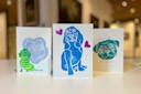 three art prints of dogs made at an Art After Hours: Printmaking class at the AKC Museum of the Dog