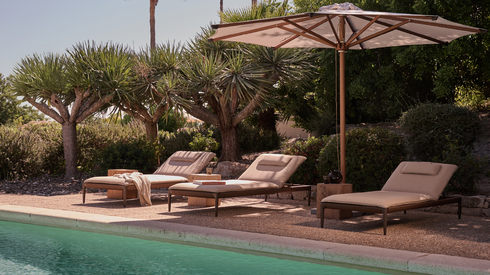 Nagomi loungers, Eclipse Umbrella, Roots side tables