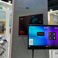 Mago at DVCOM Booth with Yealink