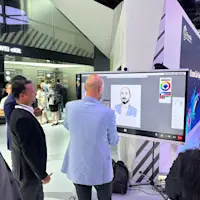 People looking at the portrait drawn on a Huawei display running Mago