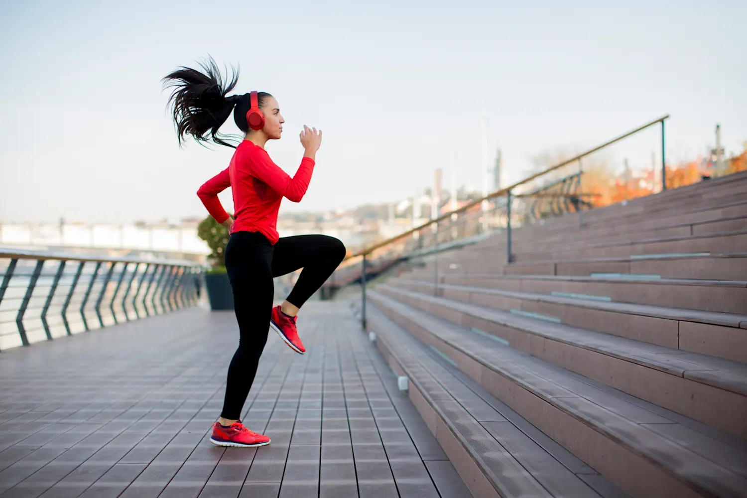 Woman doing cardio exercise workout on stairs