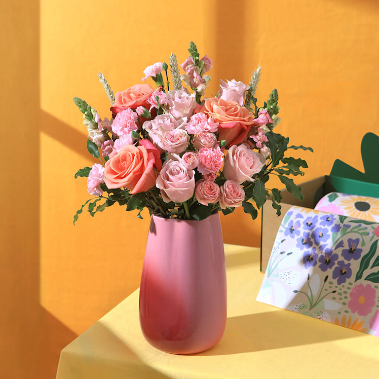 The Pearl in a pink vase on a yellow background