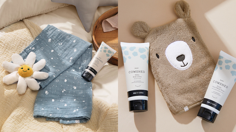A selection of Cowshed baby bath products, alongside a muslin cloth, teddy-shaped bath mitt and a plushy toy in the shape of a daisy.