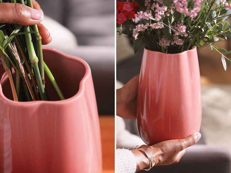 The image shows a split screen. The left side of the screen shows a close up of the neck of the vase which is a floral shape. The right hand side shows hands holding the vase with flowers in.