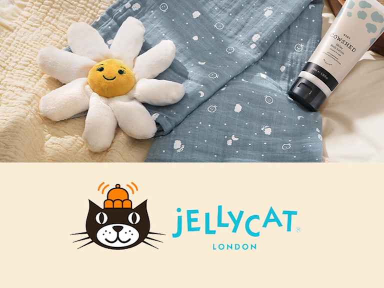 A plush Jellycat toy in the shape of a daisy, with a super cute smiley face on. 
