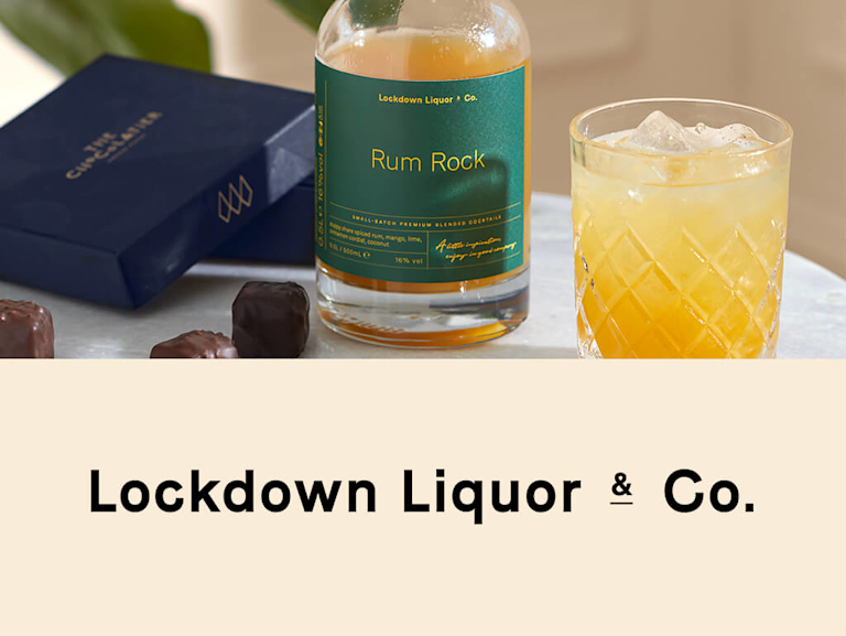 A Rum Rock cocktail in a chunky glass bottle, next to the Lockdown Liquor & Co logo