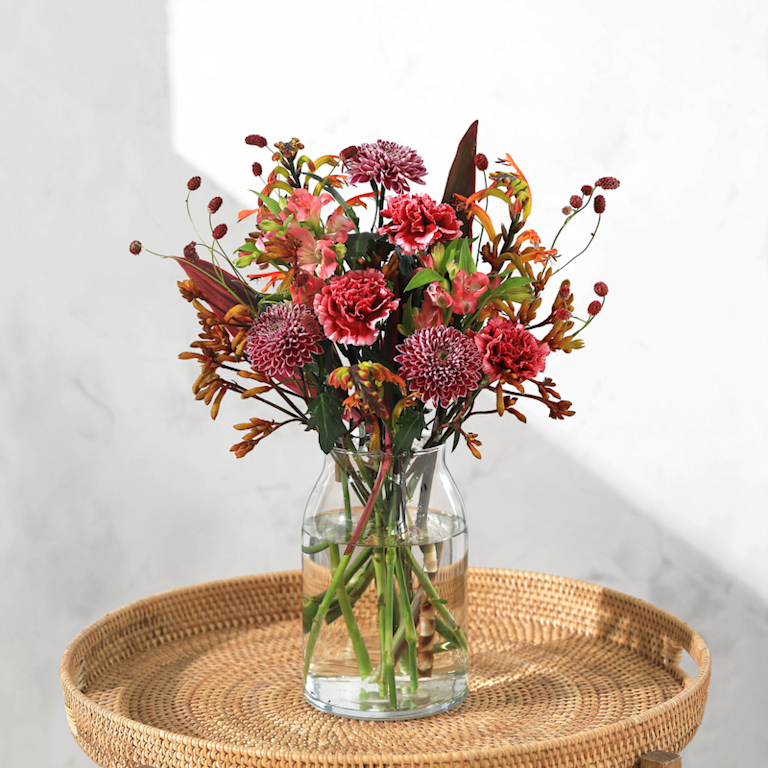 Bloom and Wild standout bouquet, featuring rich red and burgundy flowers