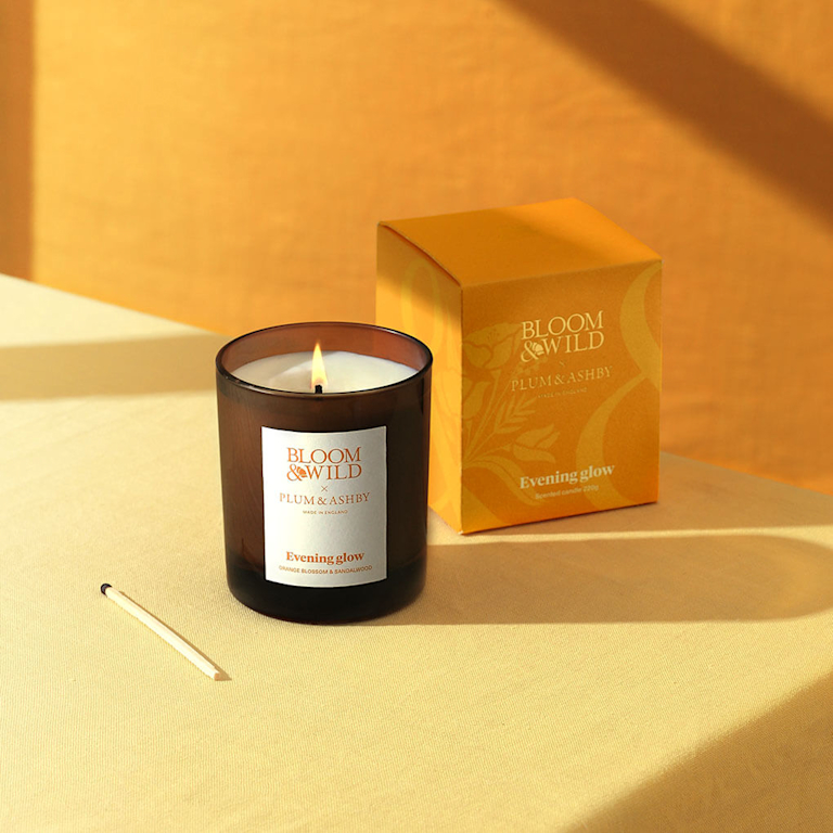 The Evening Glow Candle on a yellow background