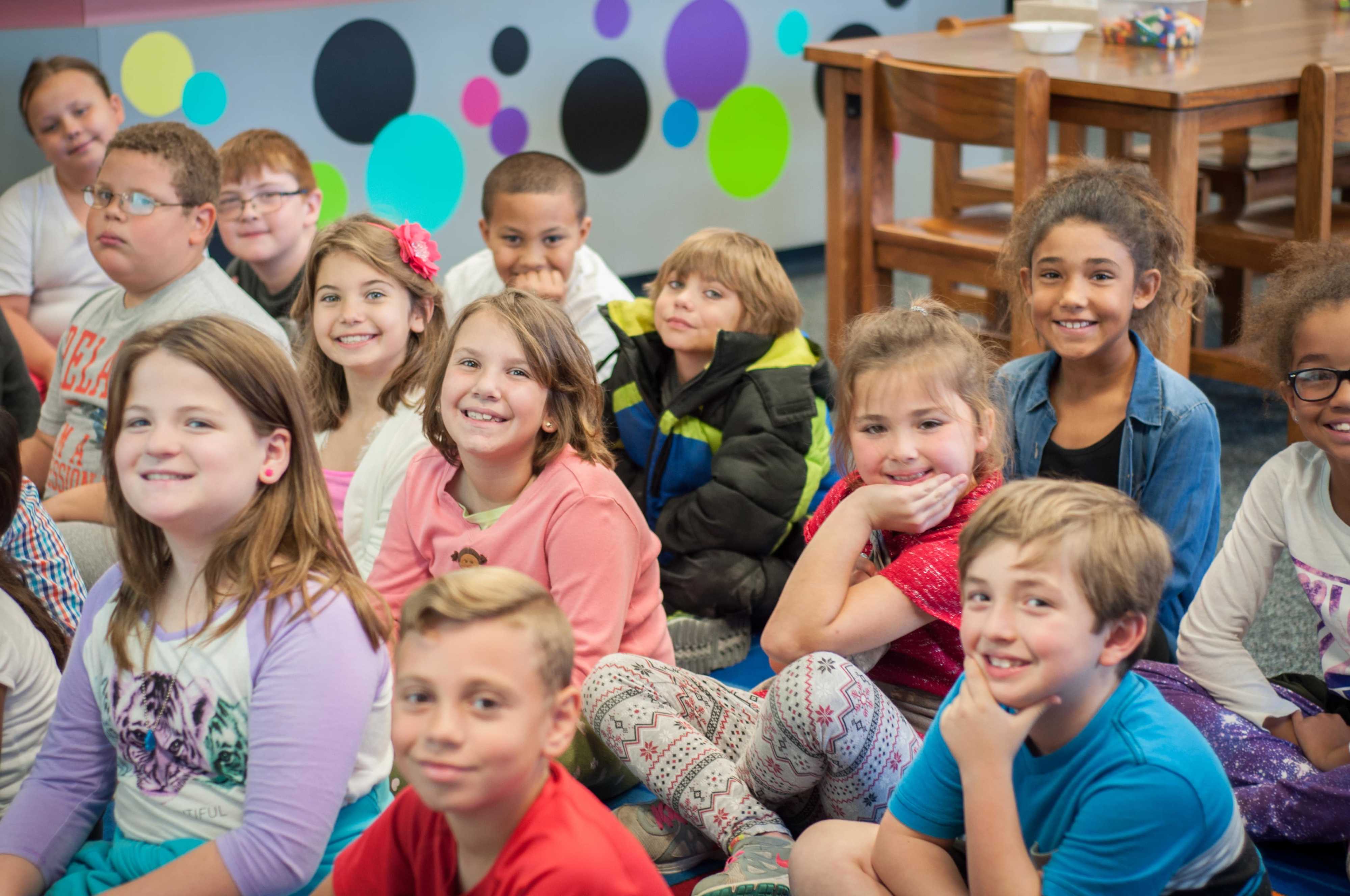 Kids smiling in a classroom