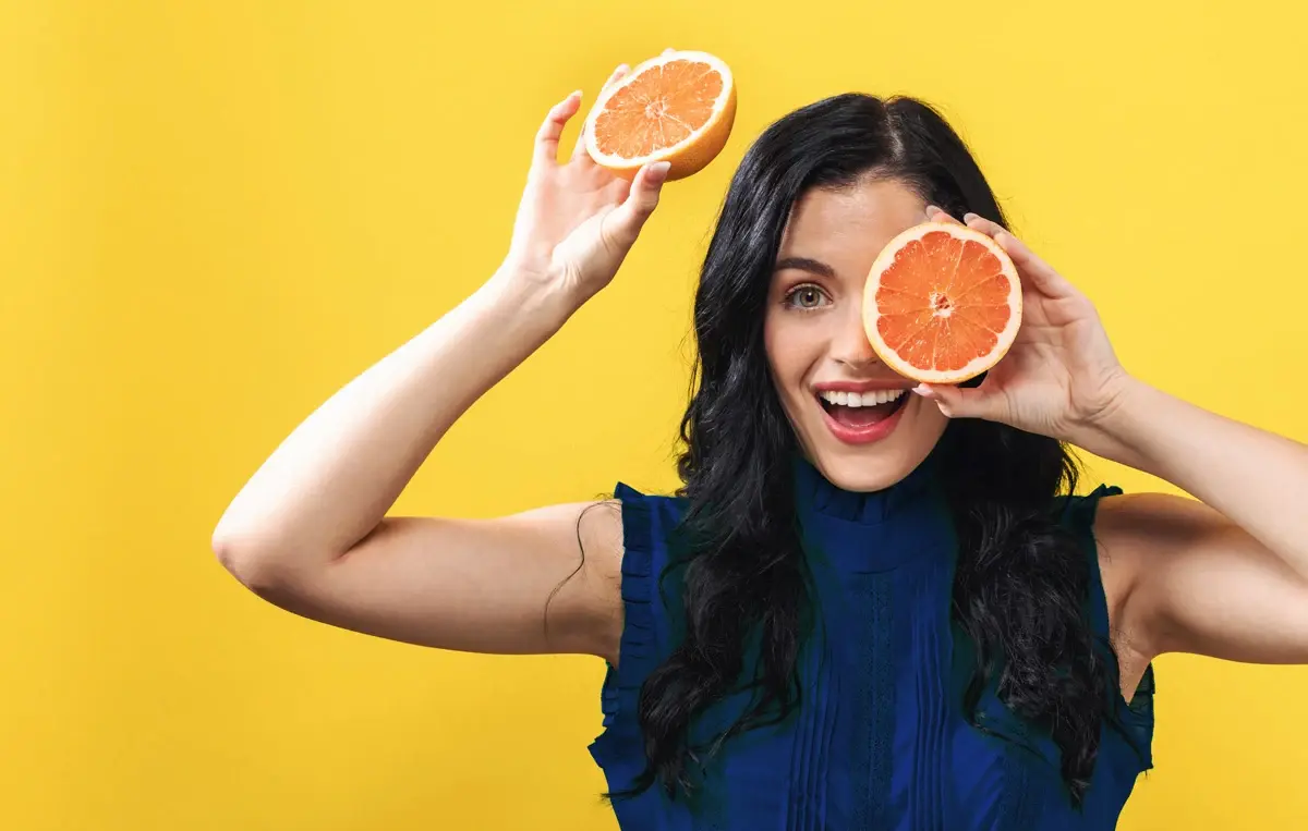 Woman with foods that trigger acid reflux