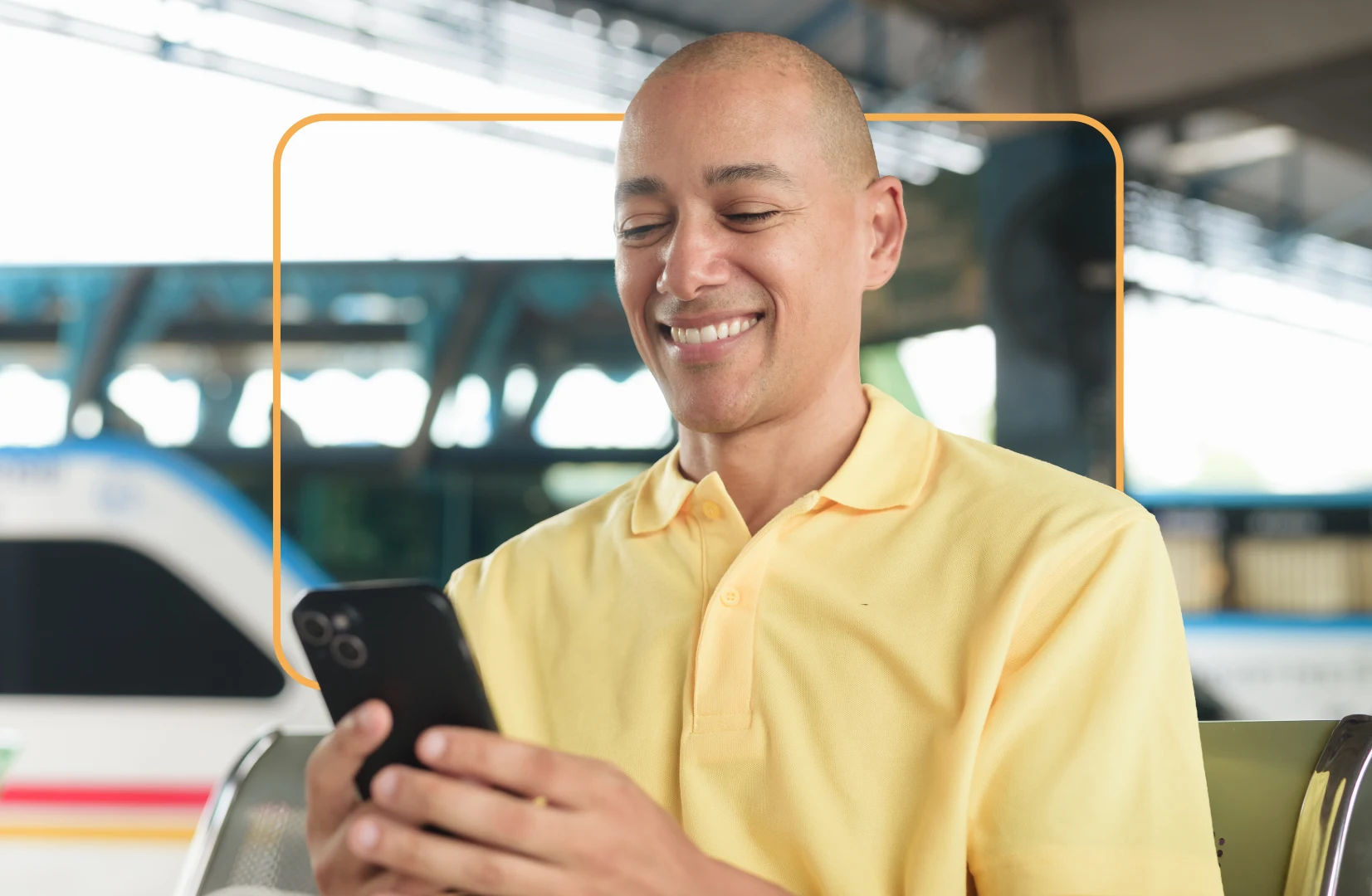 Man on bus using phone