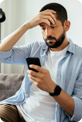 man not feeling well on his phone