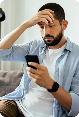 man not feeling well on his phone