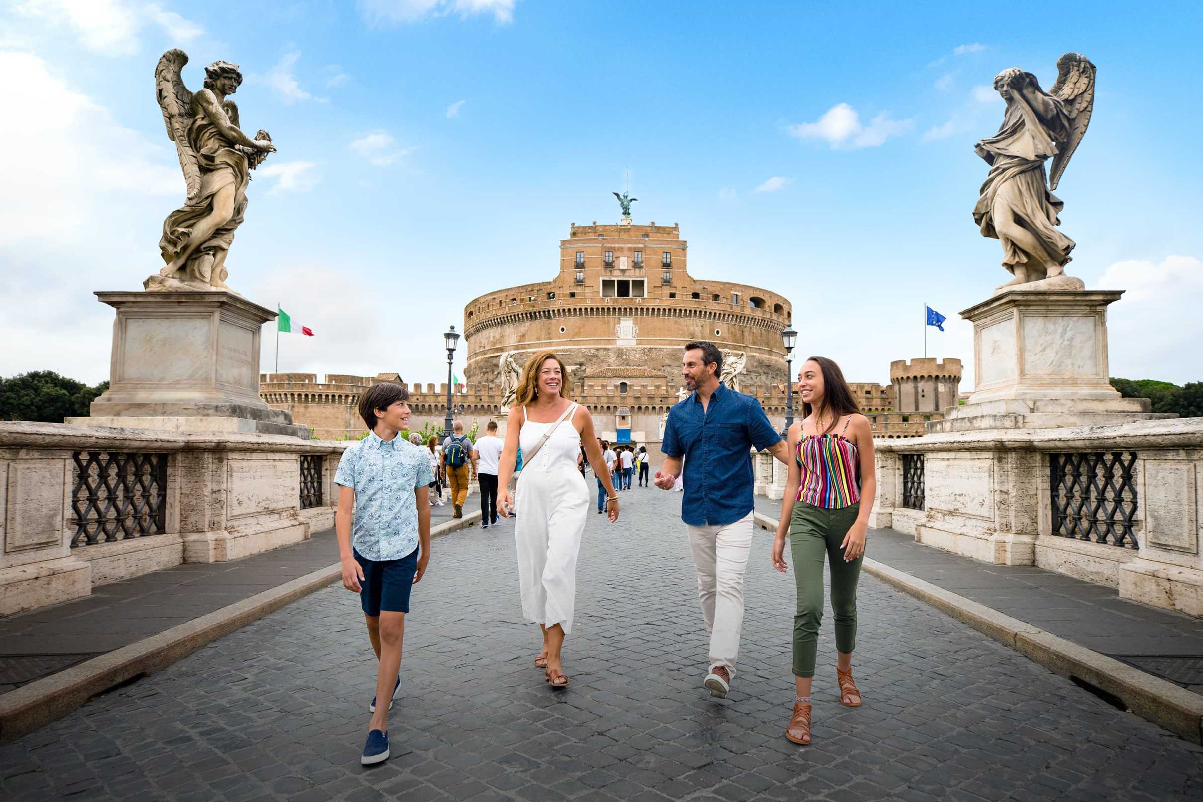 A family walking across a bridge in Rome