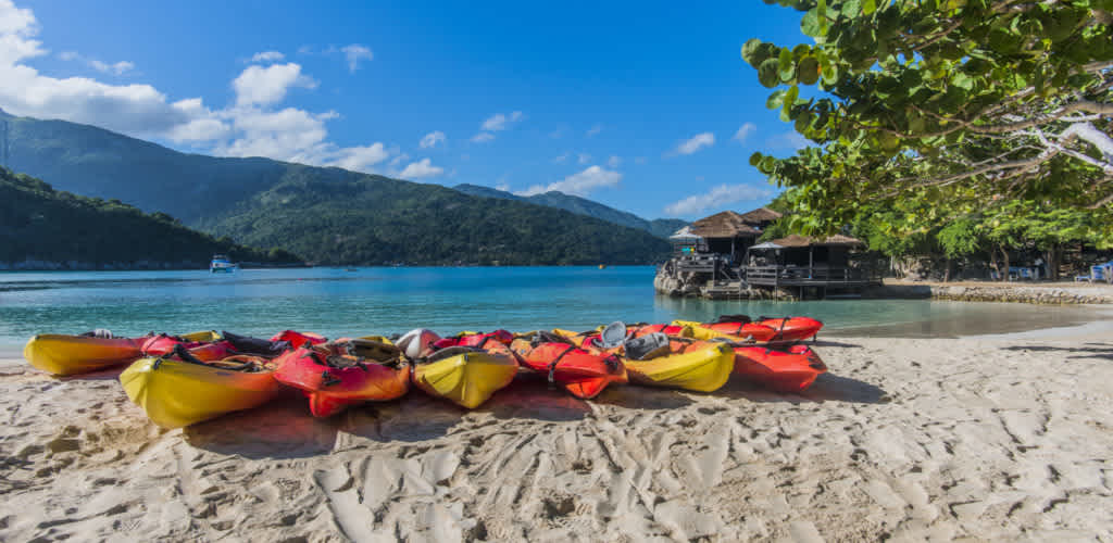 Swaying palm trees, sugar white sands and rolling green mountains set the backdrop to your day at Labadee.