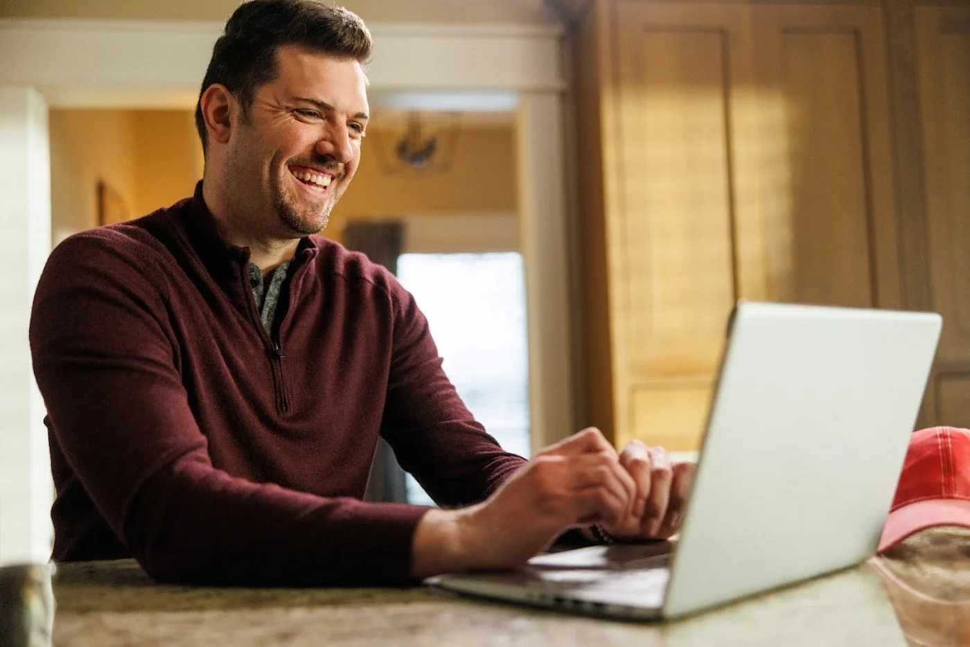 Smiling man with laptop