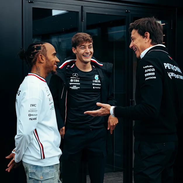 Toto Wolff, Lewis Hamilton, and George Russell chatting