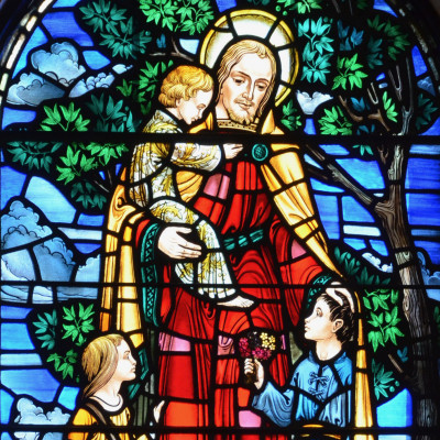 colorful stained glass window showing Jesus with Child