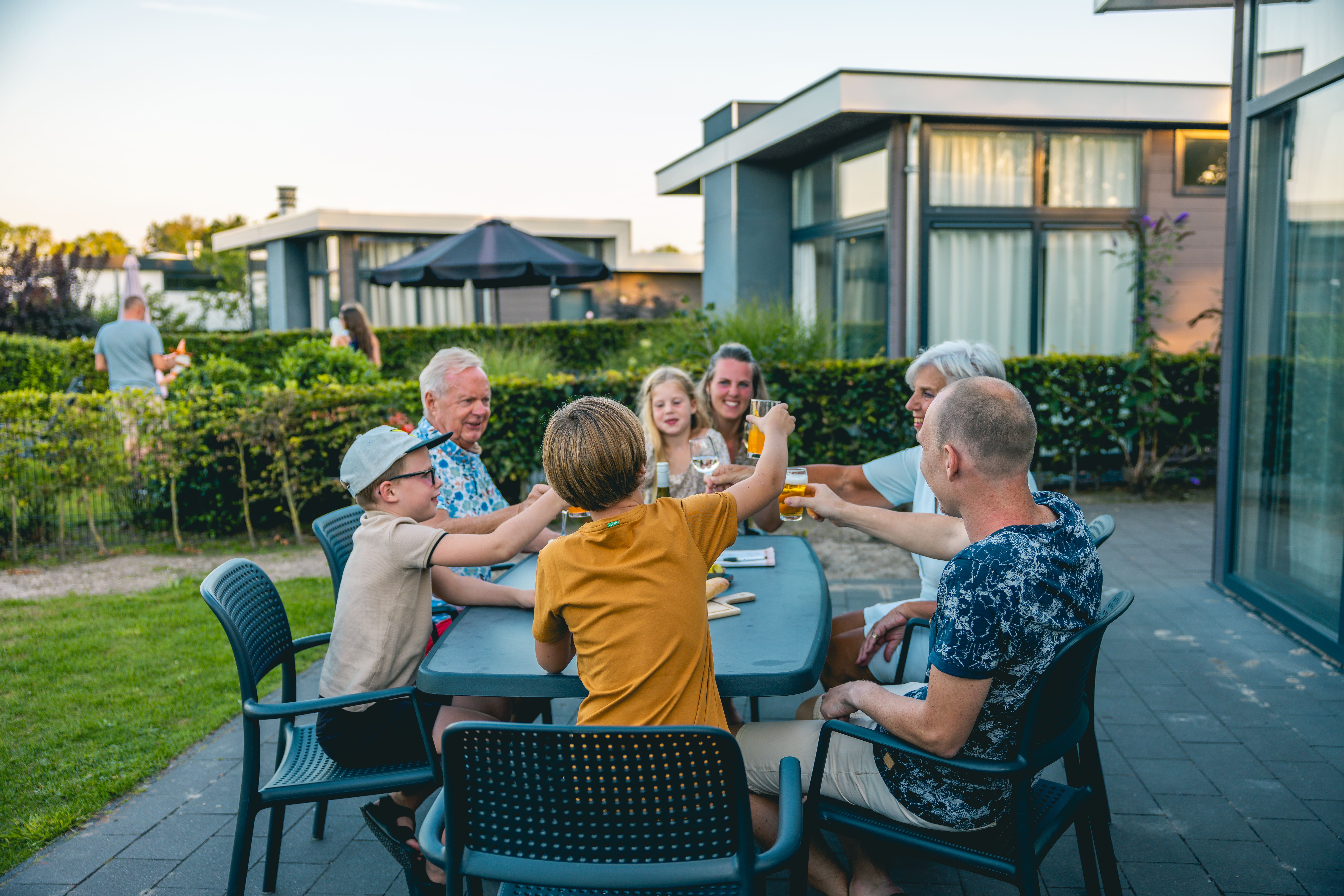 family terrace garden summer evening toasting