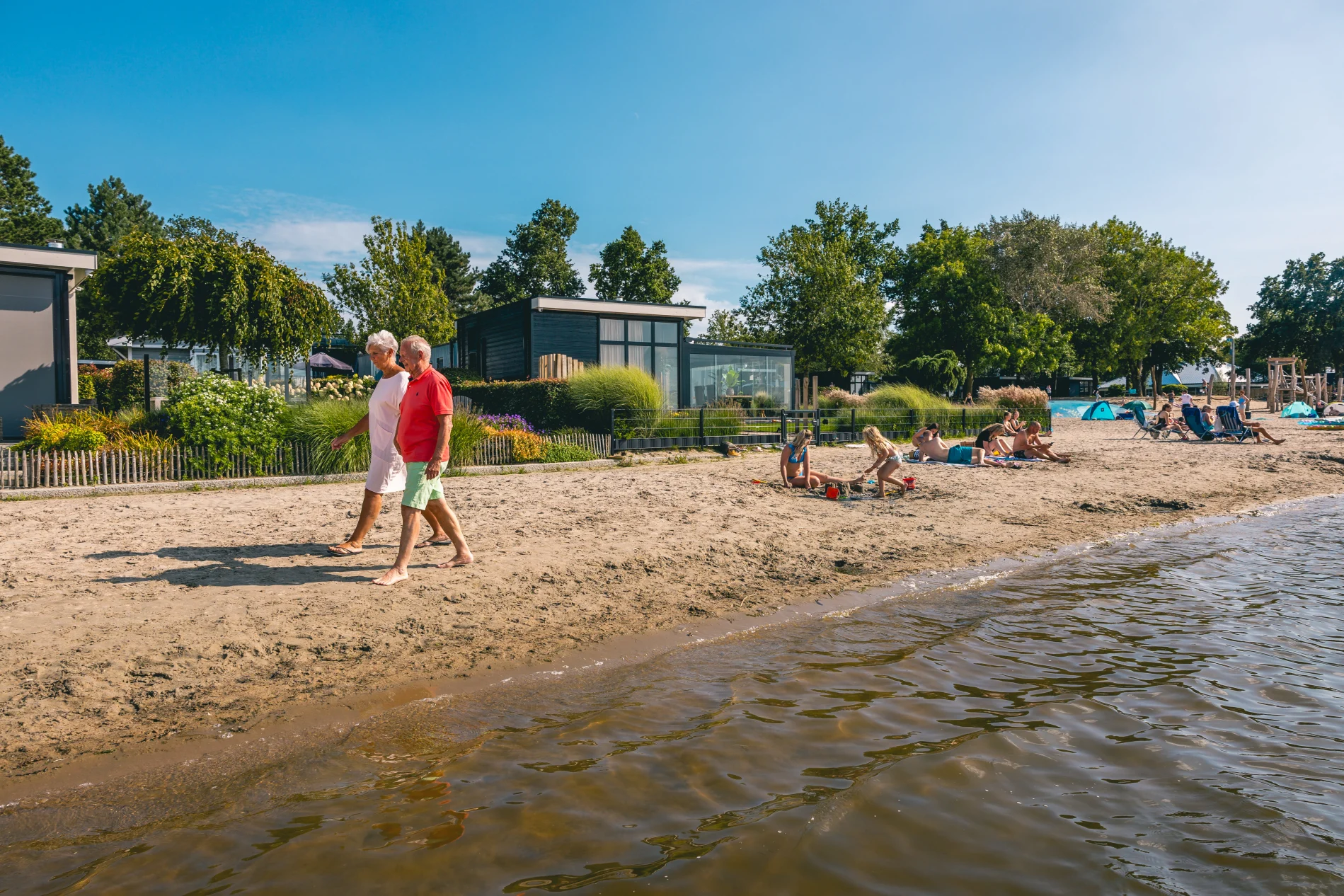 EuroParcs Veluwemeer older couple and families at the beach at the water summer sun 