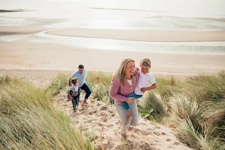 EuroParcs Ameland surrounding family at the beach