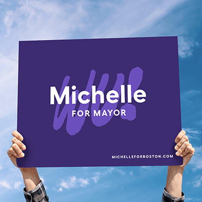 Supporter holding up Michelle for Mayor sign.