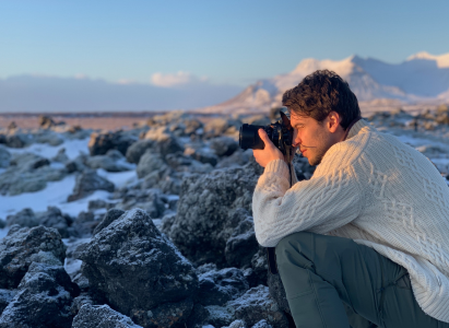 Dael Sassoon taking photos in the snowy rocks