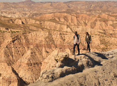 Walking through arid and rocky terrain in the heat