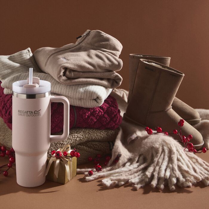 Woman wearing Regatta clothing holding christmas gifts