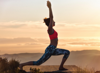 Image of woman doing warrior 1 yoga pose