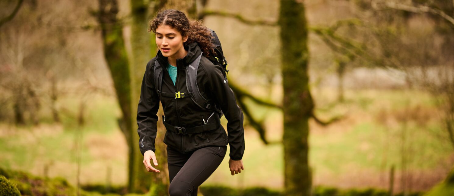 a woman hiking wearing a regatta softshell jacket