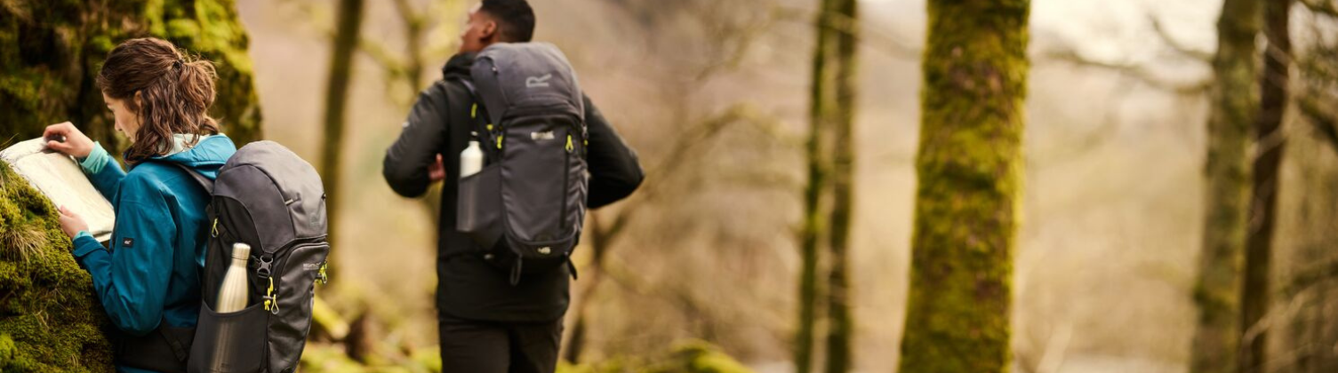 Two people hiking wearing Regatta backpacks