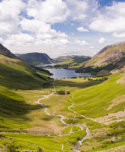 Buttermere village and lake, and Crummock Water, lie in the valley below the mountains of the English Lake District, seen from the peak of Giant Haystacks.