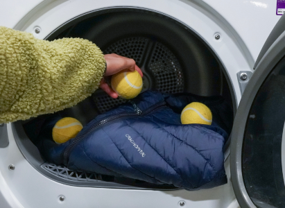 Adding dryer balls to the machine to improve the puffer jackets loft