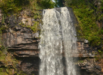 Free falling water from the Henrhyd Falls waterfall