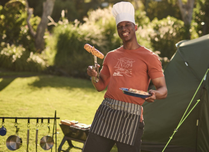 A man cooking at a campsite