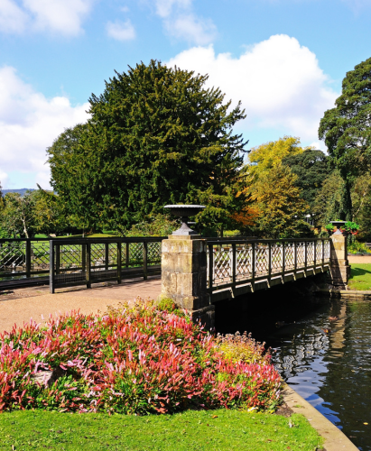 Footbridge across the lake in the Pavilion Gardens, Buxton