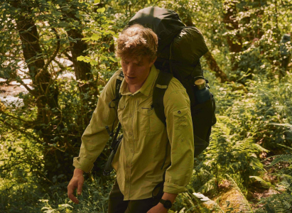 Guy hiking in the woods