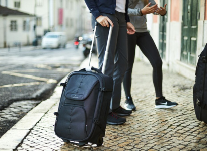 Luggage with wheels and handle