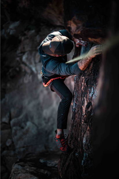 Birds eye perspective of a rock climber, climbing with rope