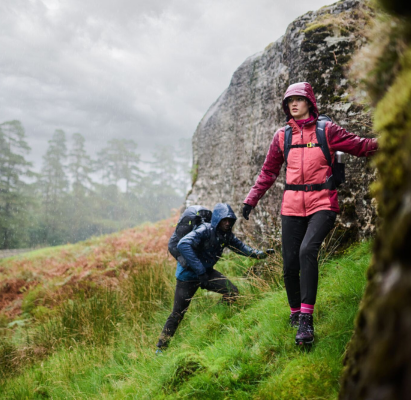 Two people walking in the hills