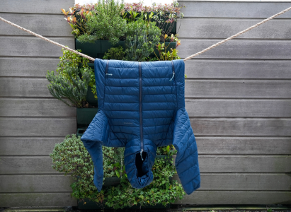 Puffer jacket finish drying on the washing line after going in the drying machine